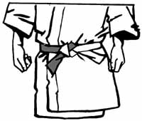 Pull tightly and tuck the left hand end through one of the layers of the belt.